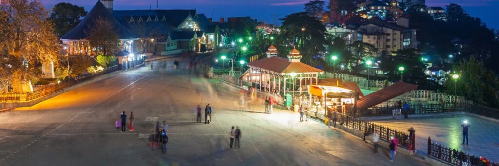 Tourists enjoying Shimla night view with local travel agencies